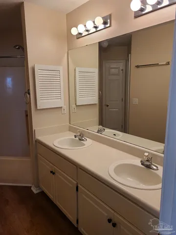 a bathroom with a sink and a mirror