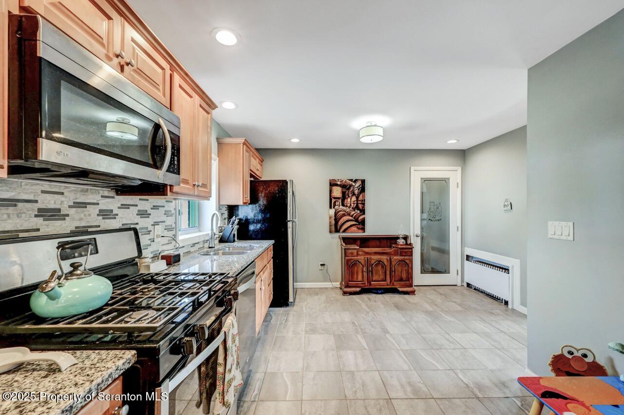 3618 Winfield Avenue Moosic, PA 18507 - Photo 19 of 54 a kitchen with a stove and a microwave
