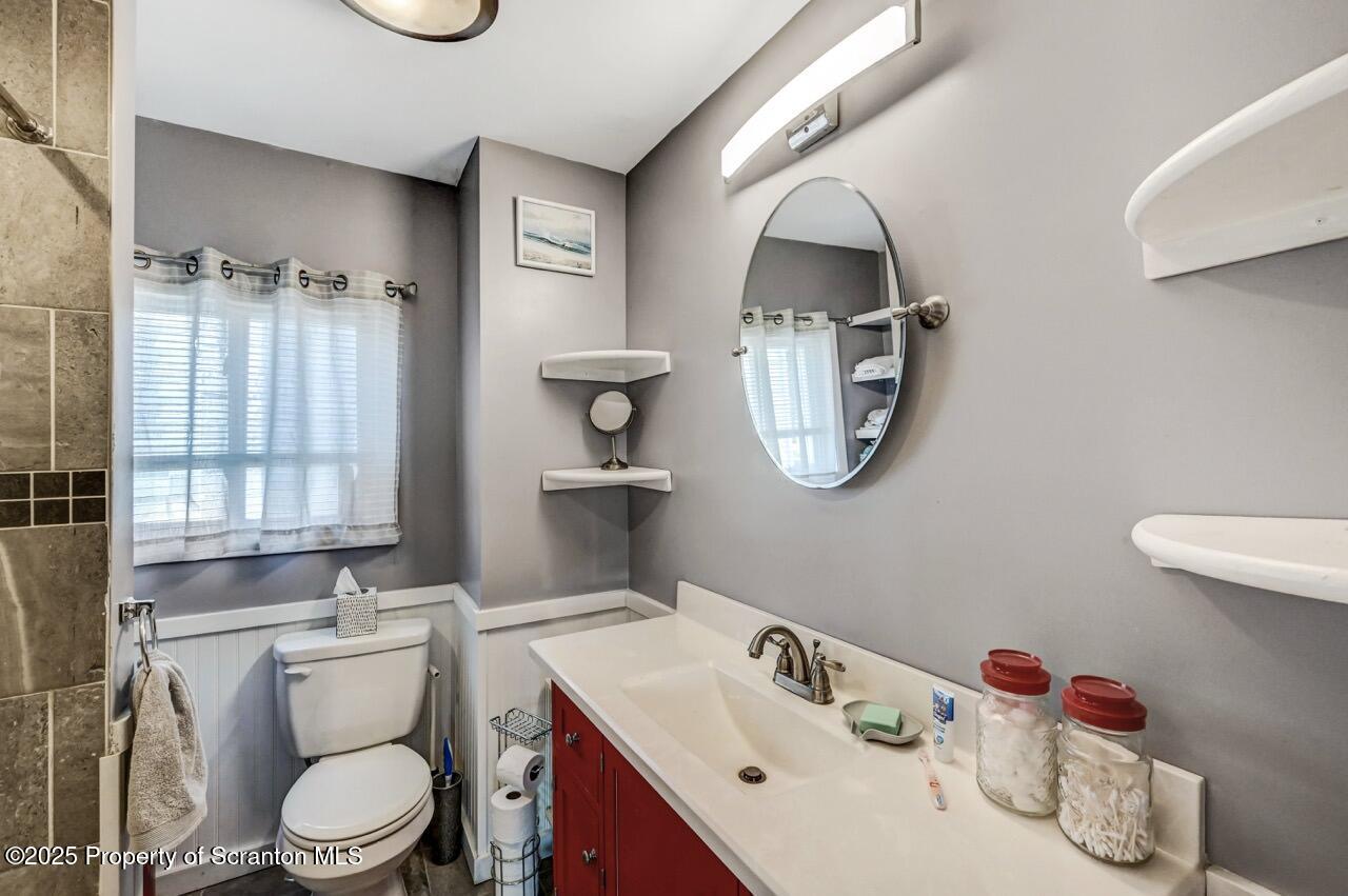 3618 Winfield Avenue Moosic, PA 18507 - Photo 25 of 54 a bathroom with a toilet sink and mirror