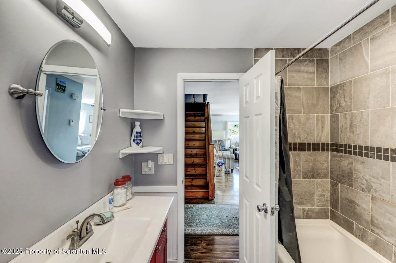 3618 Winfield Avenue Moosic, PA 18507 - Photo 27 of 54 a bathroom with a tub sink and mirror