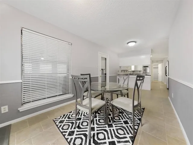 a work room with a table and chairs