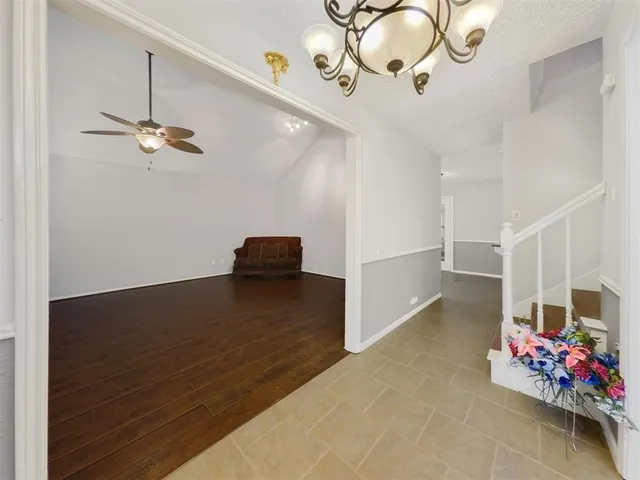 a view of an entryway with wooden floor