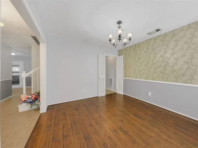 a view of livingroom with hardwood floor and ceiling fan