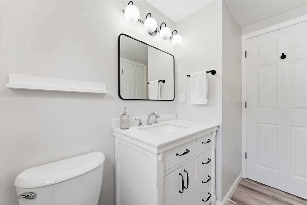 160 Cottage Street Athol, MA 01331 - Photo 22 of 35 a bathroom with a toilet sink and mirror