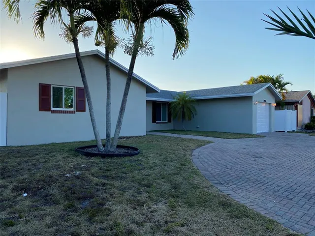 a view of a room with wooden floor and windows
