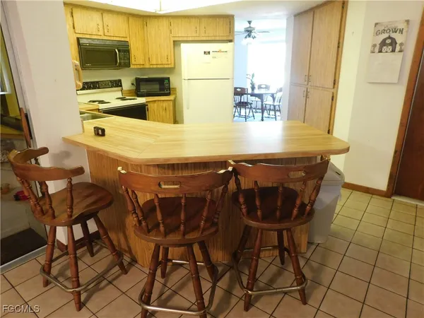 a dining room with furniture and a window