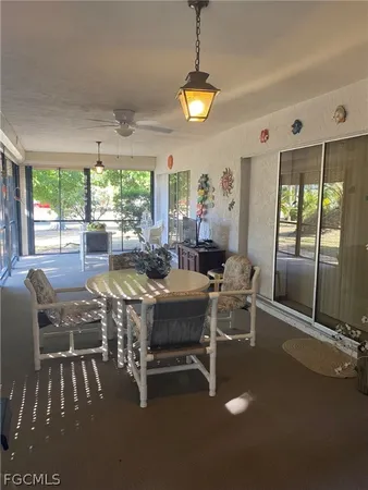 a view of a dining room with furniture window and outside view