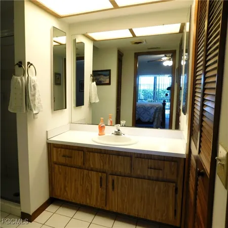 a bathroom with a double vanity sink and mirror