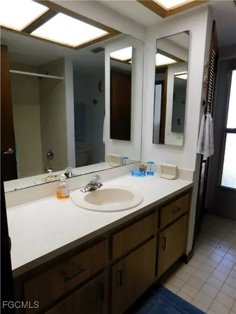 a bathroom with a sink double vanity and a mirror