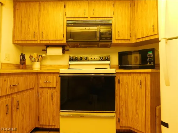 a kitchen with a stove and a microwave