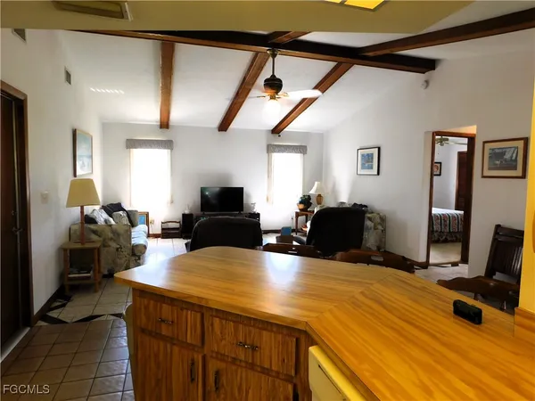 a view of a livingroom with furniture and a flat screen tv
