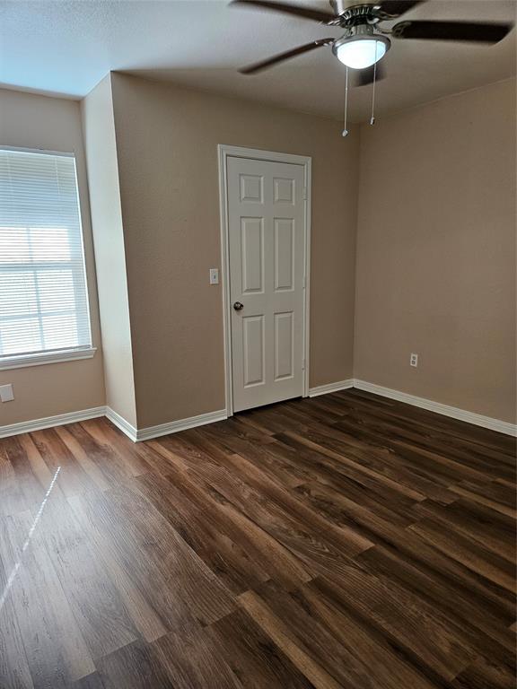 225 East Craven Avenue Lacy-Lakeview, TX 76705 - Photo 11 of 11 an empty room with wooden floor fan and windows