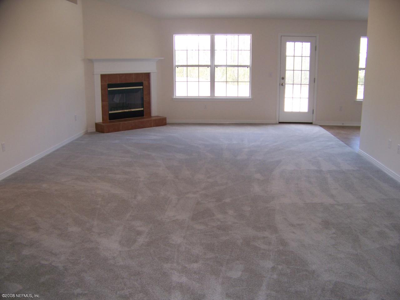 3099 Longleaf Ranch Circle Middleburg, FL 32068 - Photo 4 of 4 greatroom with tile fireplace