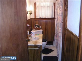 245 Holly Road Clayton, NJ 08094 - Photo 6 of 8 a bathroom with a sink and a mirror