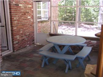 245 Holly Road Clayton, NJ 08094 - Photo 8 of 8 a view of a patio with table and chairs