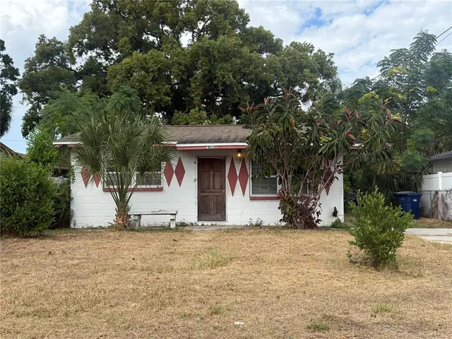 a view of a house with a tree
