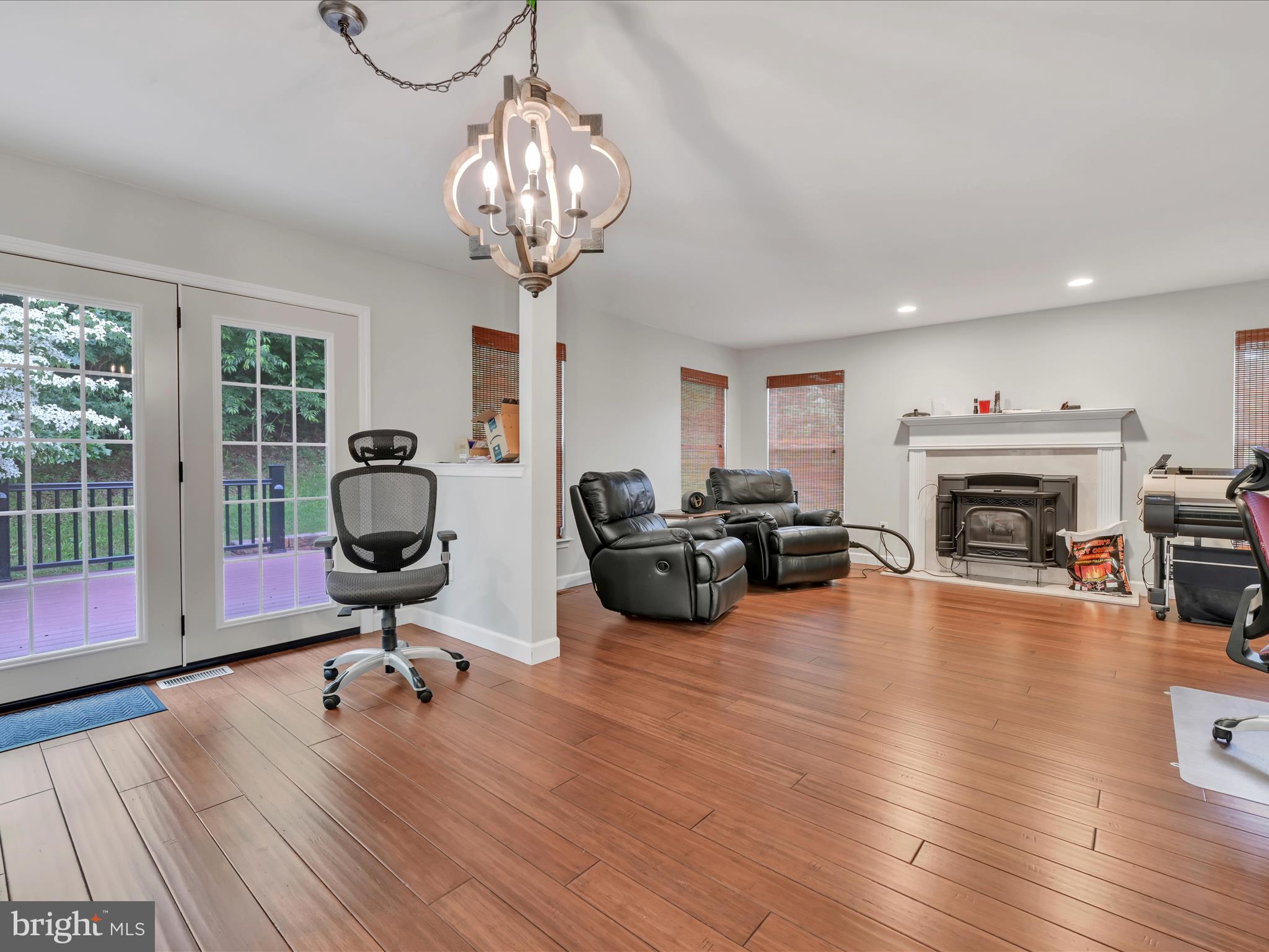 15 Country Club Road Ashland, PA 17921 - Photo 16 of 39 a living room with furniture a fireplace and a floor to ceiling window