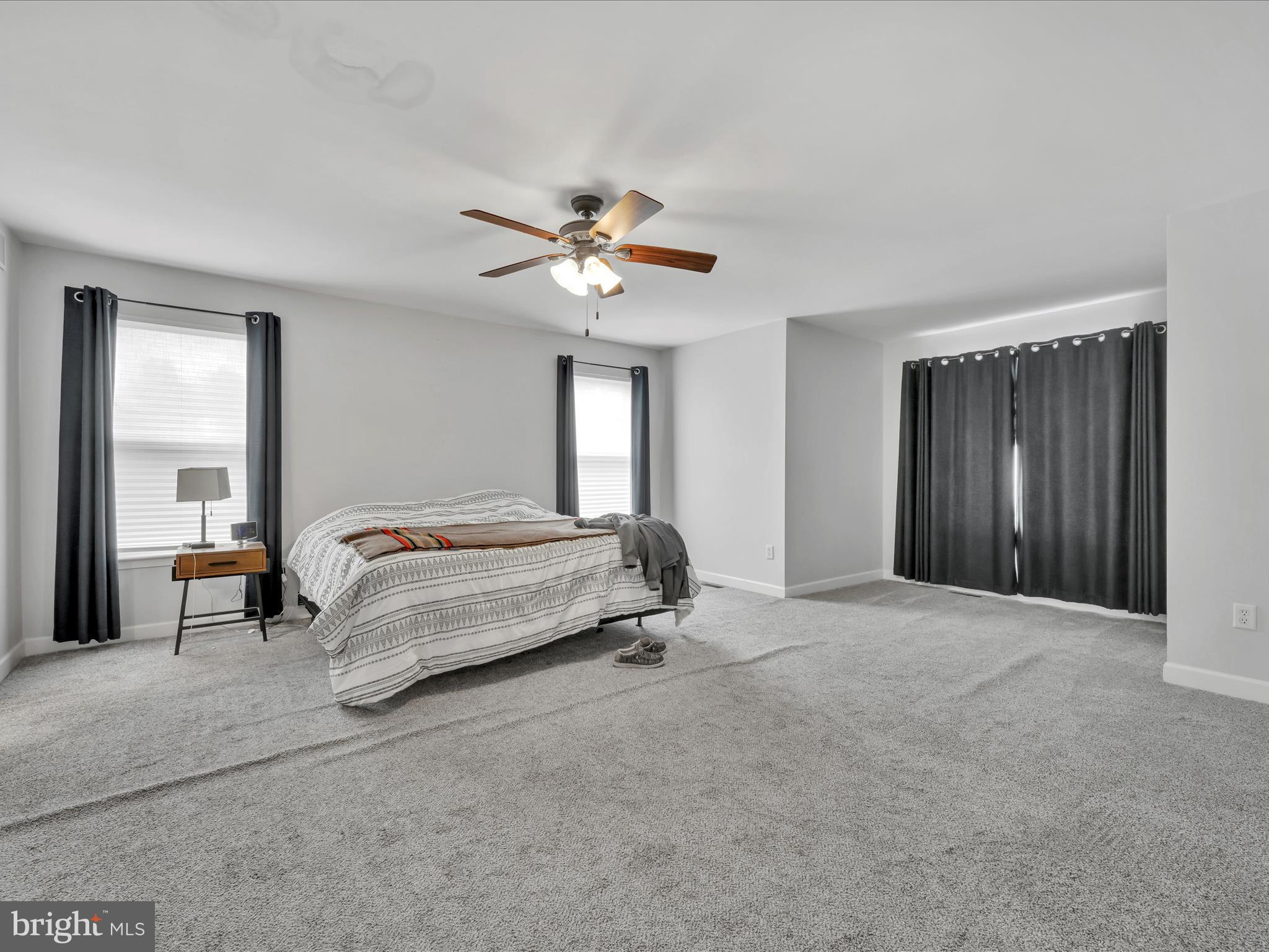 15 Country Club Road Ashland, PA 17921 - Photo 22 of 39 a bedroom with a bed and a chandelier