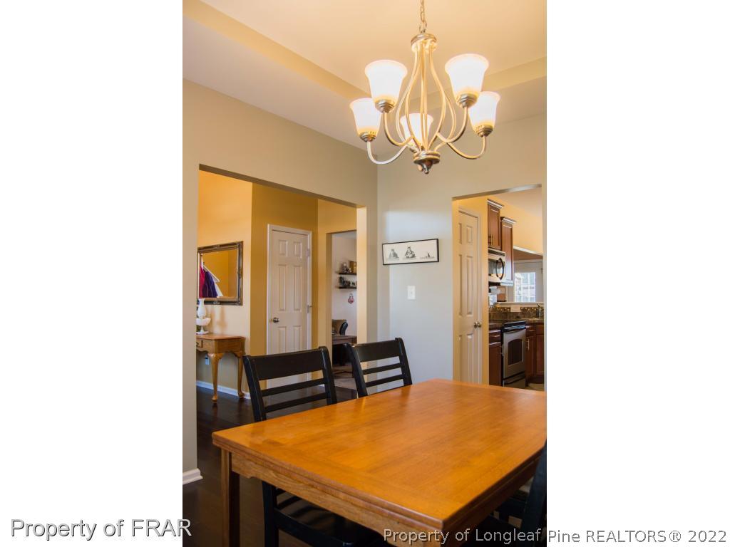 1444 Rough Rider Lane Parkton, NC 28371 - Photo 18 of 36 a room with table and chairs