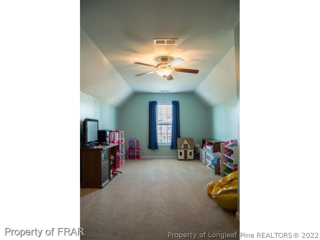 1444 Rough Rider Lane Parkton, NC 28371 - Photo 34 of 36 a view of a room with furniture and a ceiling fan