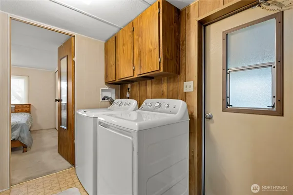 a utility room with dryer and washer
