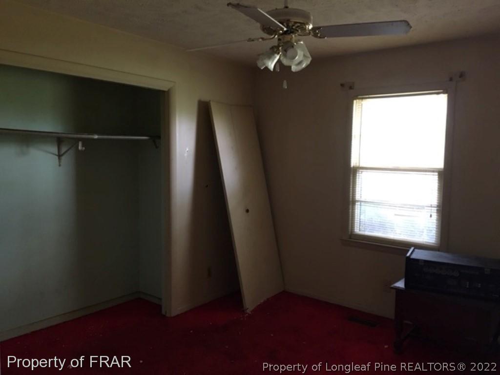 4204 White Pond Road Fairmont, NC 28340 - Photo 5 of 5 a view of an empty room with a window