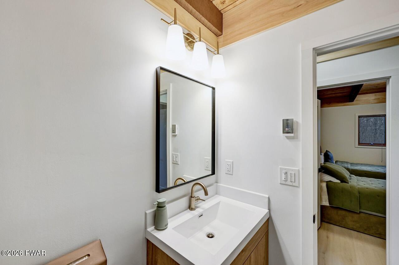 258 Lakeview Road Lackawaxen, PA 18435 - Photo 40 of 119 a bathroom with a sink a mirror and shower
