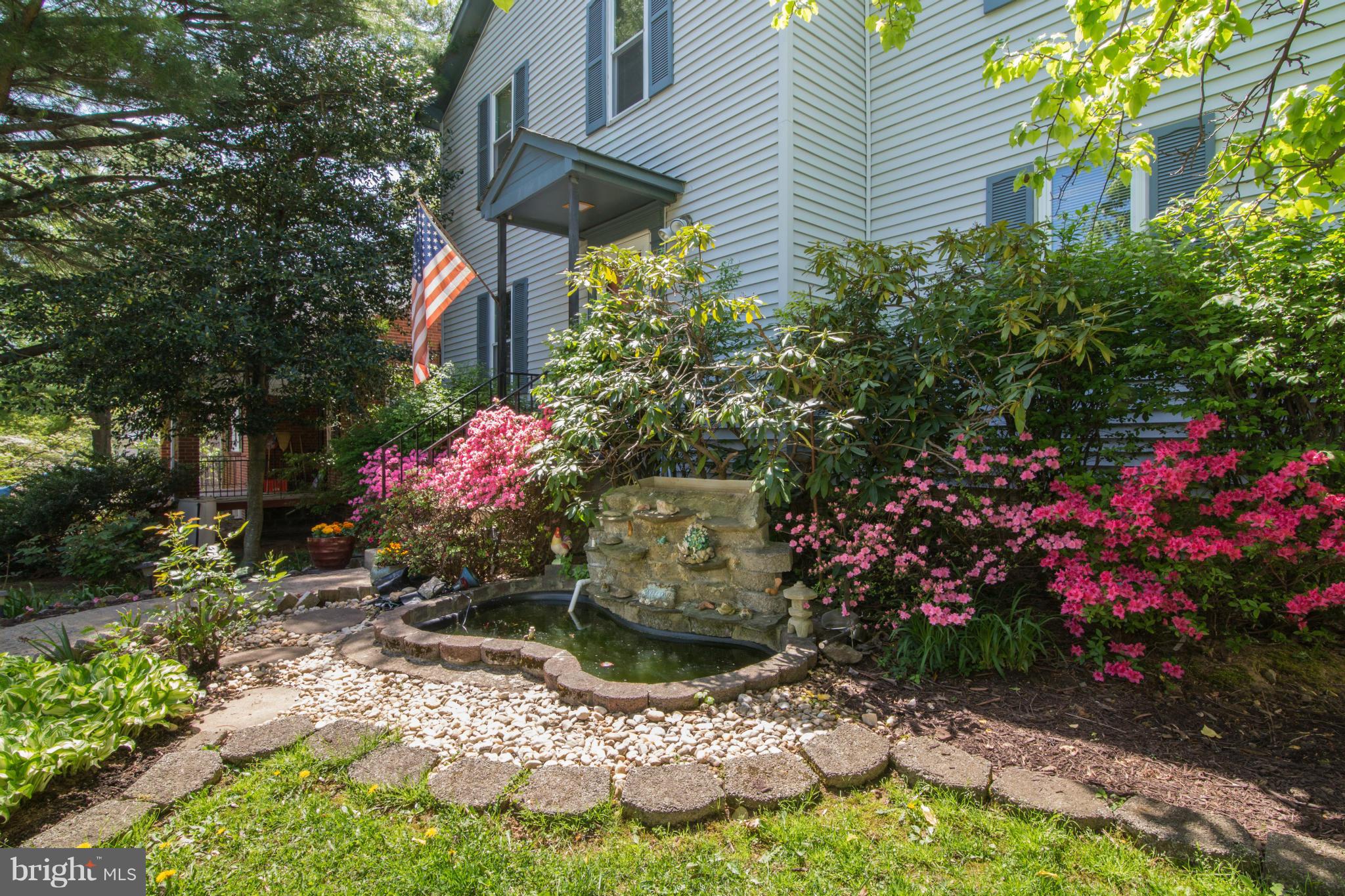 716 Ritchie Avenue Silver Spring, MD 20910 - Photo 2 of 22 Beautiful landcaped front lawn with a pond