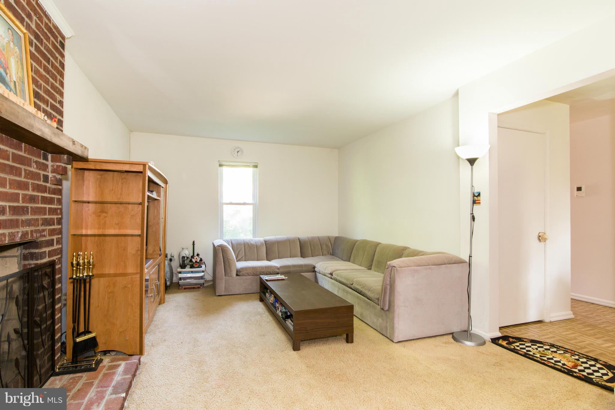 716 Ritchie Avenue Silver Spring, MD 20910 - Photo 10 of 22 Family Room w/ wood burning fireplace