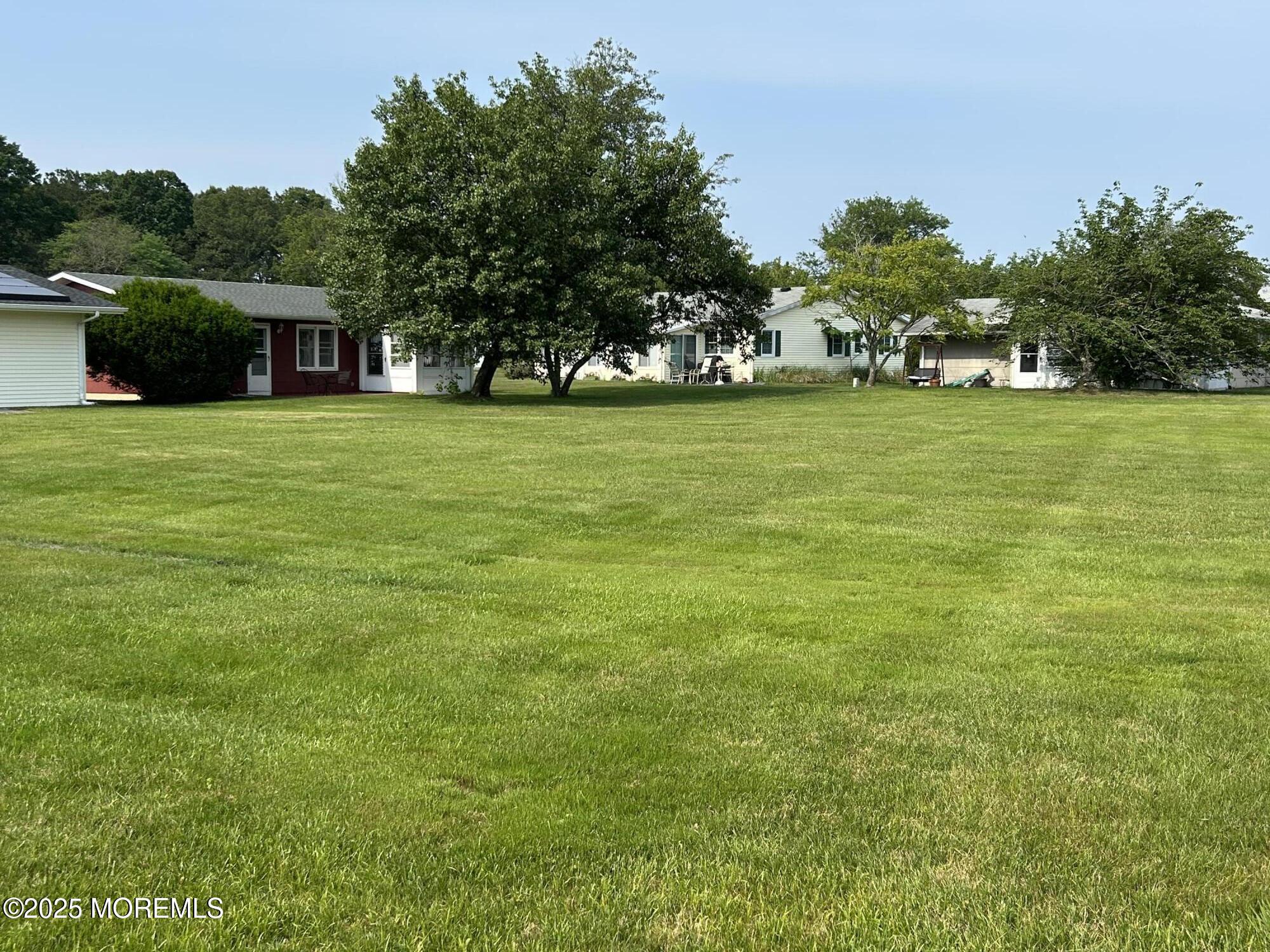 5 Lamb Road Brick, NJ 08724 - Photo 27 of 38 a view of house with garden space and trees