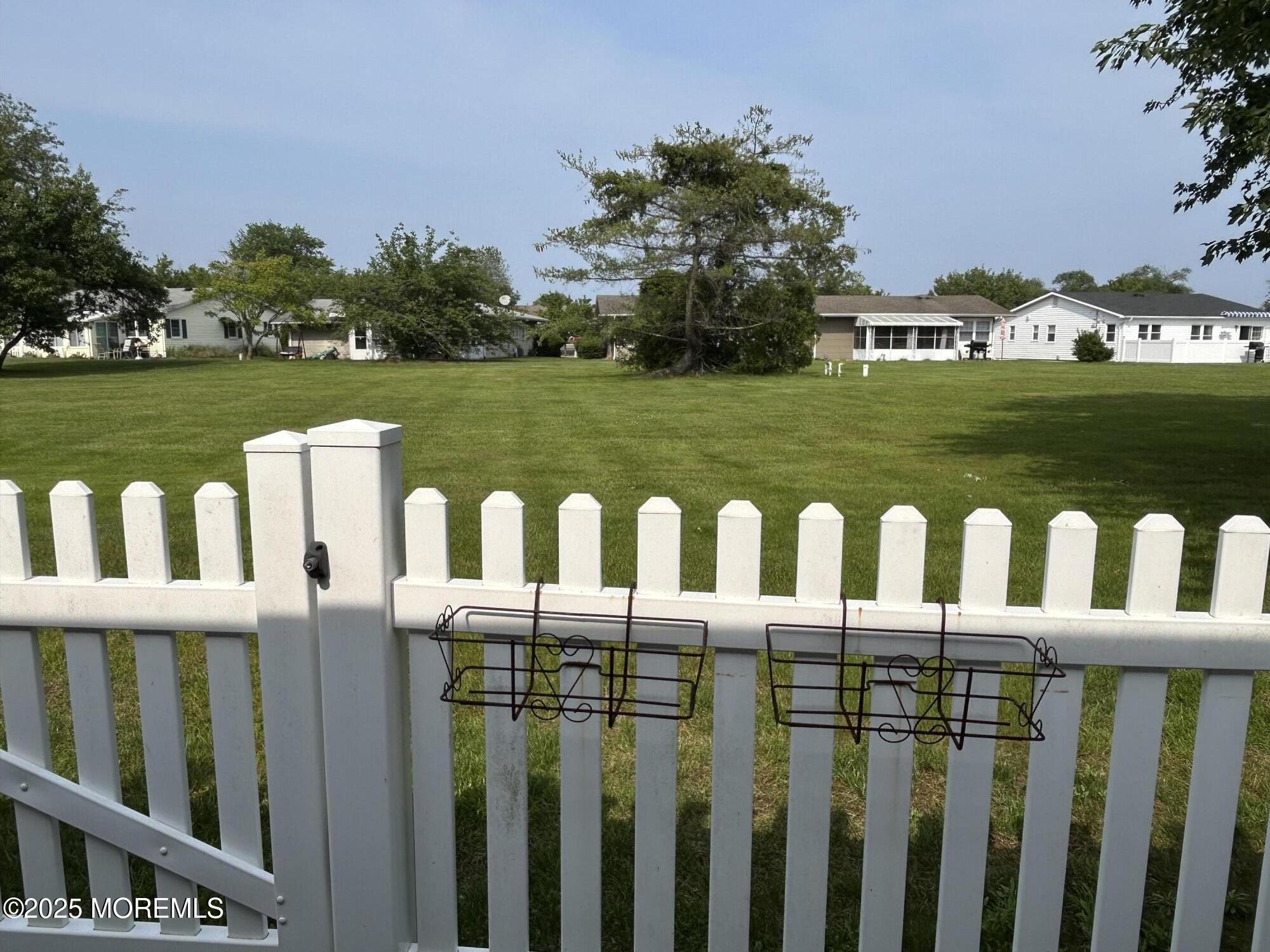 5 Lamb Road Brick, NJ 08724 - Photo 30 of 38 a view of a wooden fence and a yard