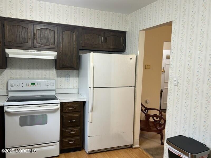 5 Lamb Road Brick, NJ 08724 - Photo 5 of 38 a kitchen with a refrigerator stove and cabinets