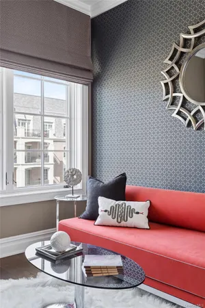 a bedroom with furniture and a window