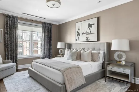 a bedroom with bed and a couch