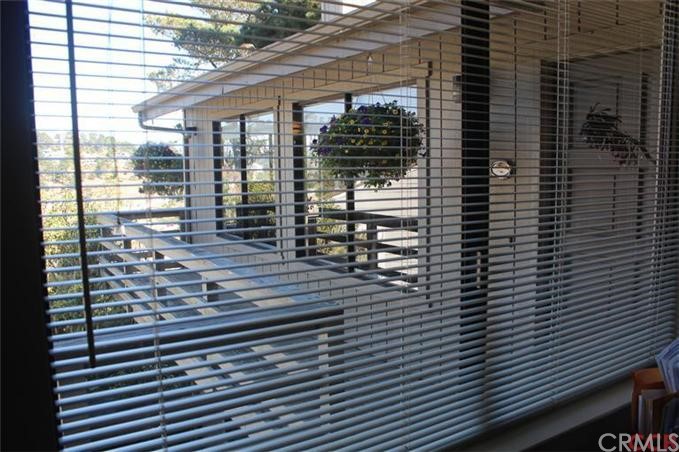 660 Huntington Road Cambria, CA 93428 - Photo 1 of 1 Front of house from an interior window on main floor which has its entrance at street / driveway level.