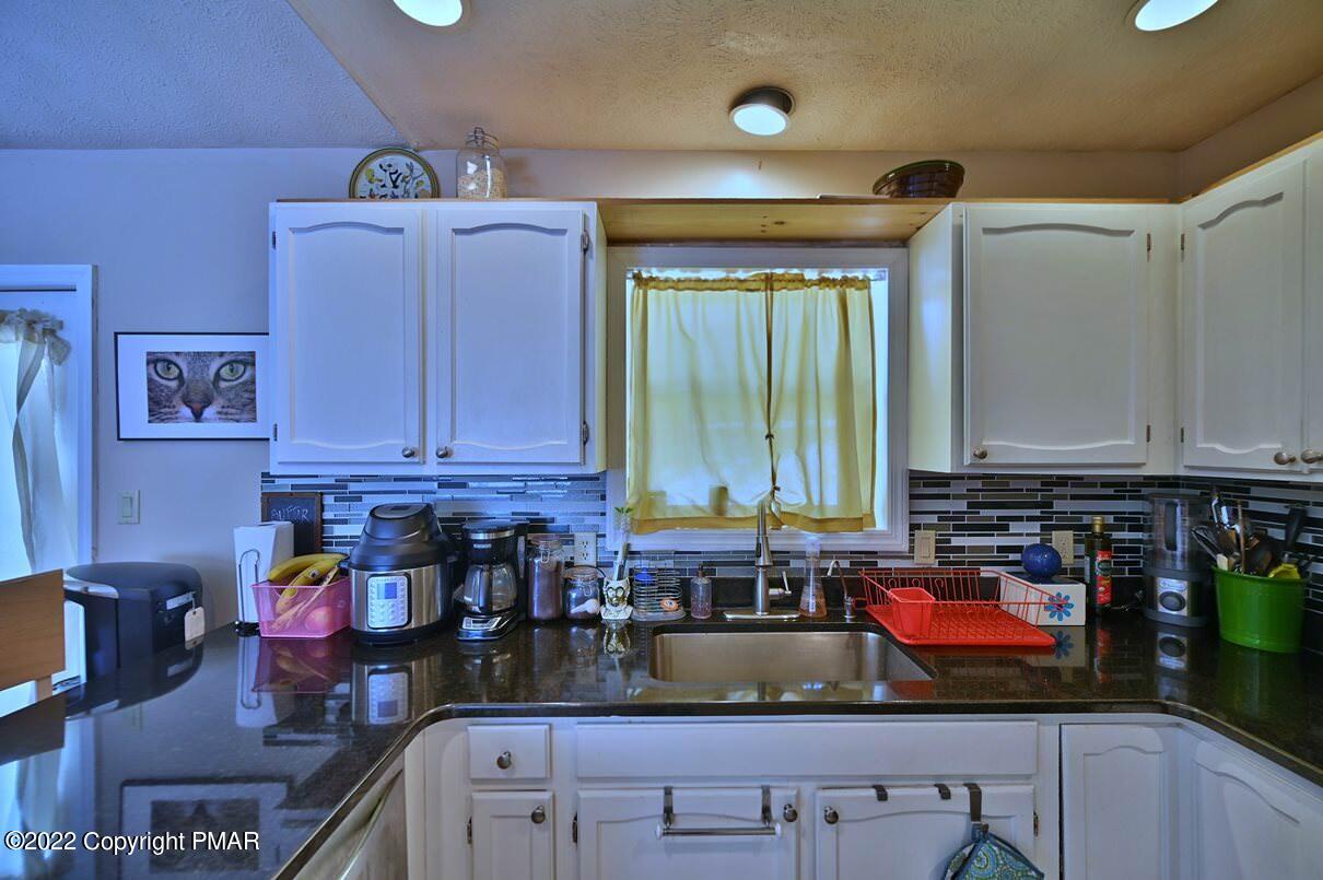 1039 Dancing Ridge Road East Stroudsburg, PA 18302 - Photo 16 of 40 a kitchen with lots of counter top space and wooden floor