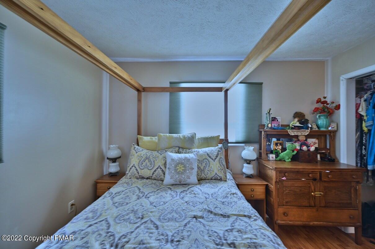 1039 Dancing Ridge Road East Stroudsburg, PA 18302 - Photo 26 of 40 a bed room with a bed and a dresser