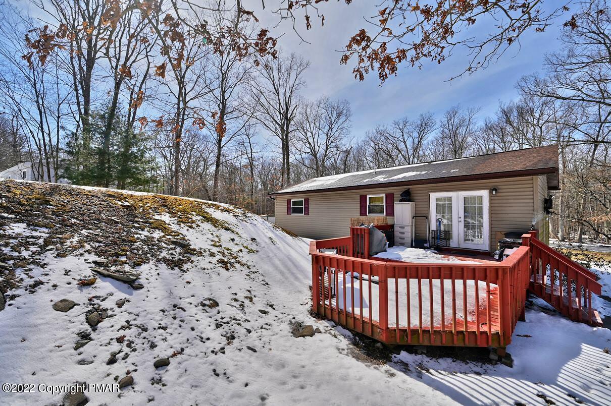 1039 Dancing Ridge Road East Stroudsburg, PA 18302 - Photo 32 of 40 a front view of a house with a garden