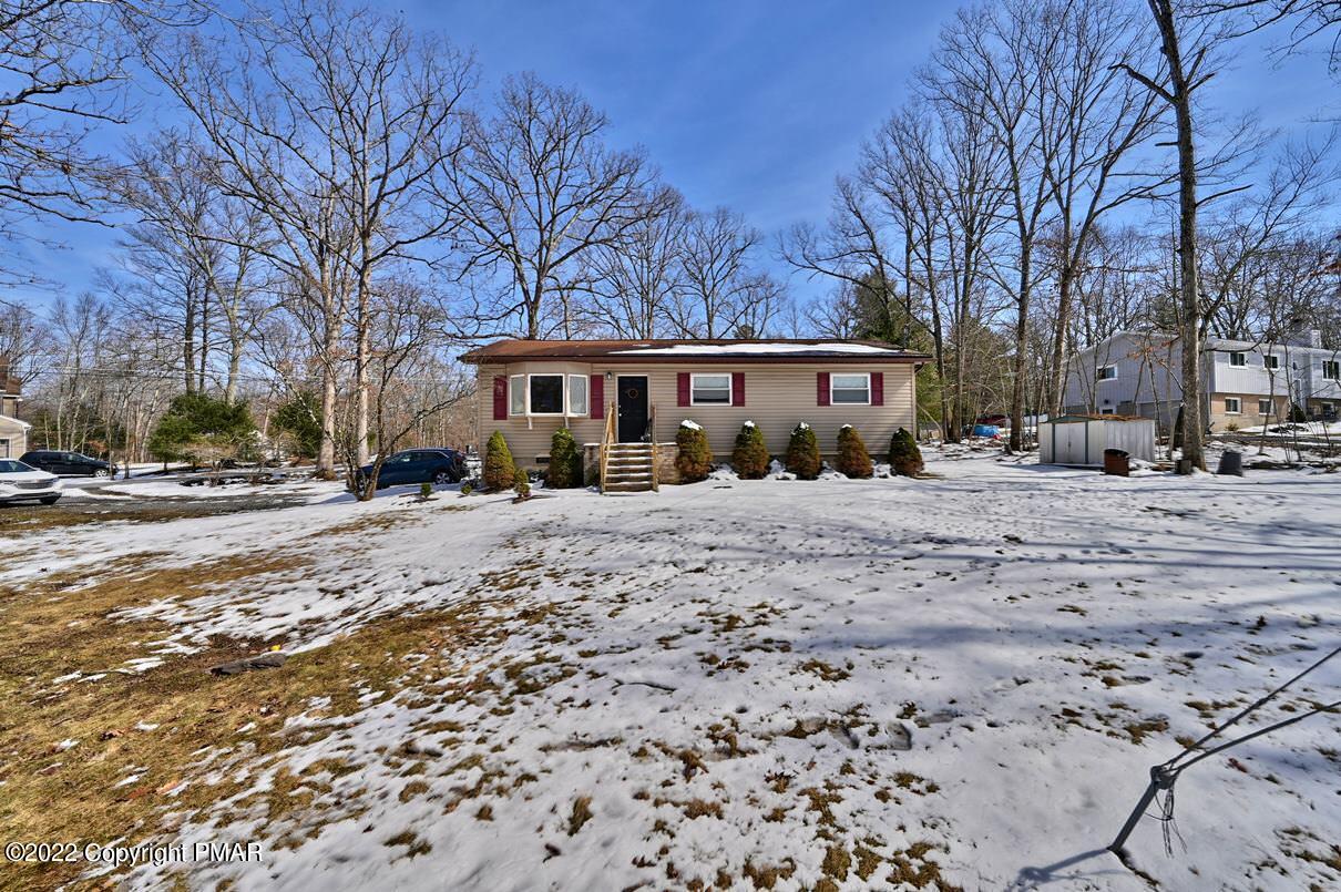 1039 Dancing Ridge Road East Stroudsburg, PA 18302 - Photo 36 of 40 a front view of a building with snow on the road