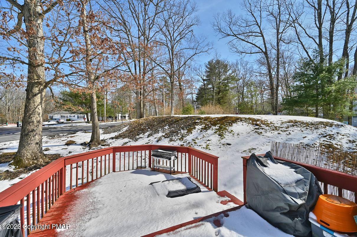 1039 Dancing Ridge Road East Stroudsburg, PA 18302 - Photo 40 of 40 a view of a roof deck with wooden fence and floor