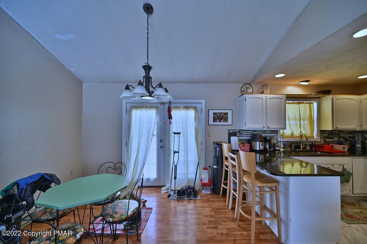 1039 Dancing Ridge Road East Stroudsburg, PA 18302 - Photo 9 of 40 a view of a dining room with furniture window and wooden floor