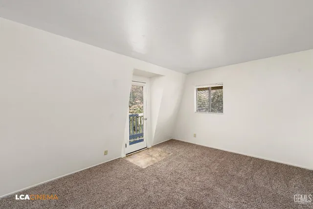 an empty room with a empty space and a window