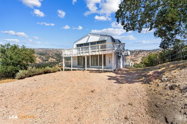 a view of a house with a snow in the yard