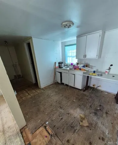 a room with furniture and wooden floor