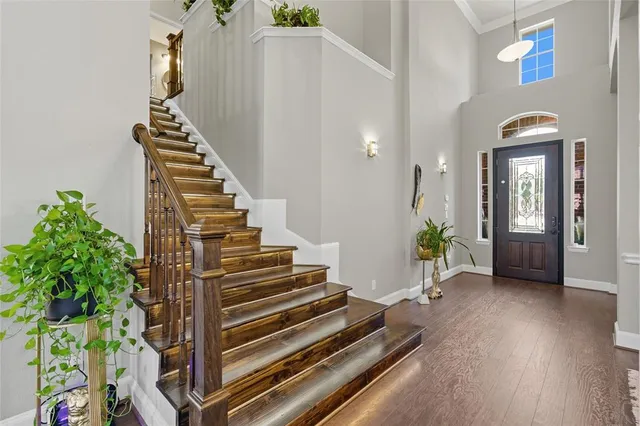 a view of an entryway with wooden floor