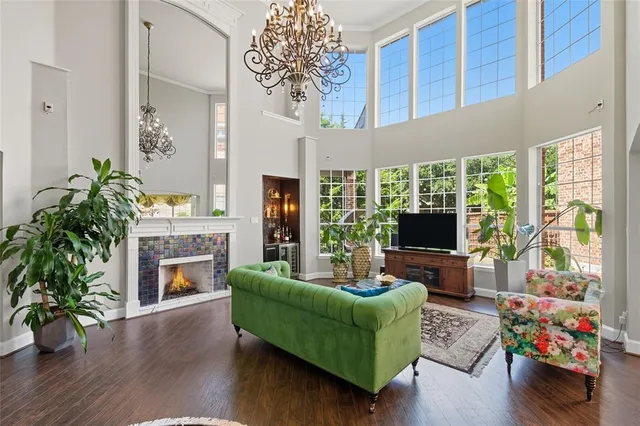 a living room with furniture fireplace and flat screen tv