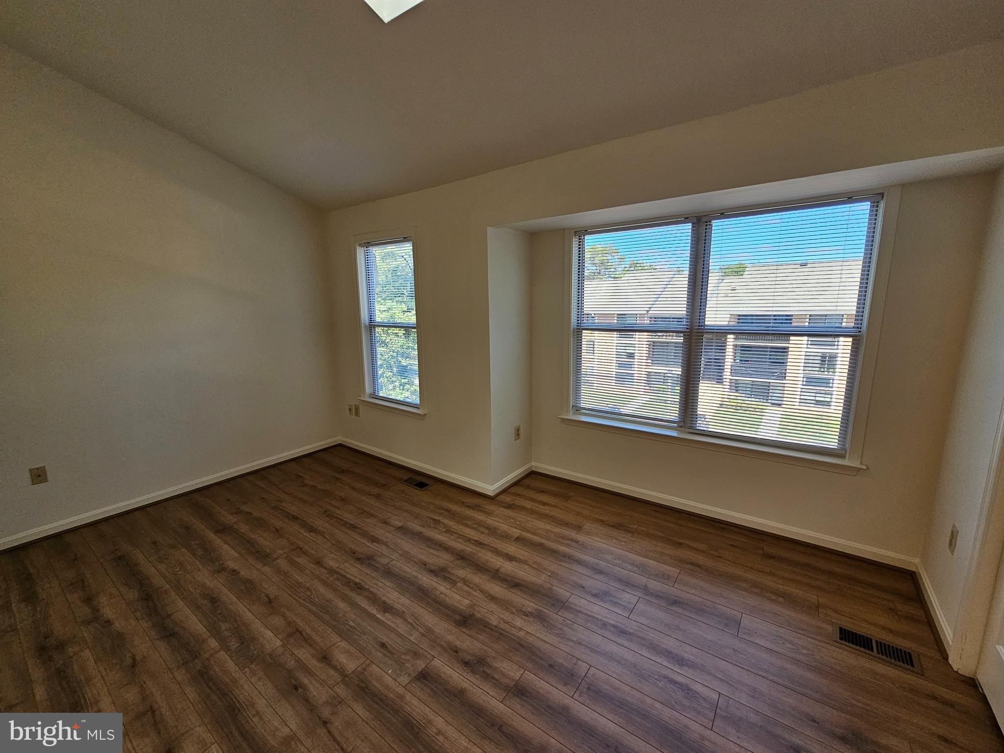 6306 Over See Court Springfield, VA 22152 - Photo 12 of 30 a view of an empty room with wooden floor and a window