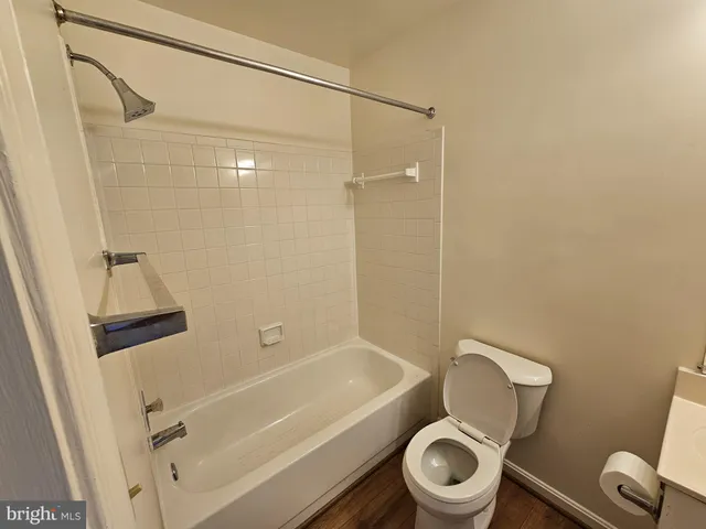 a bathroom with a tub and a shower