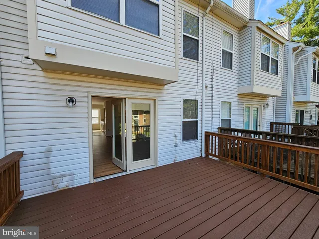 a view of balcony with deck and wooden floor