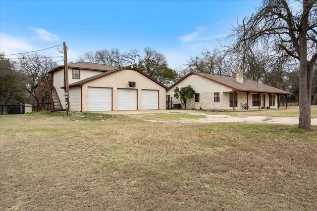 a house with trees in the background